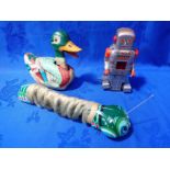 A DAIYA JAPANESE TINPLATE AND PLUSH ARTICULATED WIND-UP CATERPILLAR