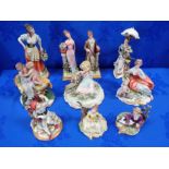 A COLLECTION OF CAPODIMONTE FIGURINES
