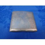 A CURVED SILVER CIGARETTE CASE