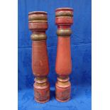 A NEAR PAIR OF TURNED AND PAINTED WOOD LARGE PRICKETT CANDLESTICKS