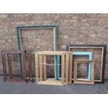 A SET OF THREE REGENCY STYLE REEDED AND GILT PICTURE FRAMES