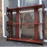 A MAHOGANY HANGING SHELF WITH FRETWORK SIDES