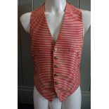 A RED AND CREAM STRIPED FOOTMAN'S LIVERY VEST OR WAISTCOAT