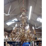 A SIX-BRANCH GILT METAL CHANDELIER, WITH GLASS DROPS