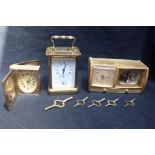 A BRASS CASED CARRIAGE ALARM CLOCK