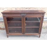 AN EDWARDIAN MAHOGANY GLAZED BOOKCASE