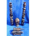 A PAIR OF AFRICAN CARVED CANDLESTICKS