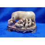 A CHINESE STEATITE CARVING OF A SOW AND PIGLETS