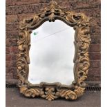 A 19TH CENTURY ROCOCO STYLE CARVED AND GILT MIRROR