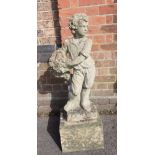 A RECONSTITUTED STONE GARDEN FIGURE OF A BOY