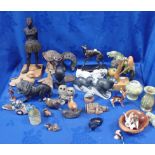 A COLLECTION OF STONE ANIMALS AND STATUES