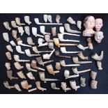 A COLLECTION OF EXCAVATED CLAY PIPES