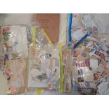 A LARGE QUANTITY OF LOOSE MIXED WORLD STAMPS
