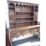 AN EDWARDIAN STAINED PINE DRESSER, ON CABRIOLE LEGS