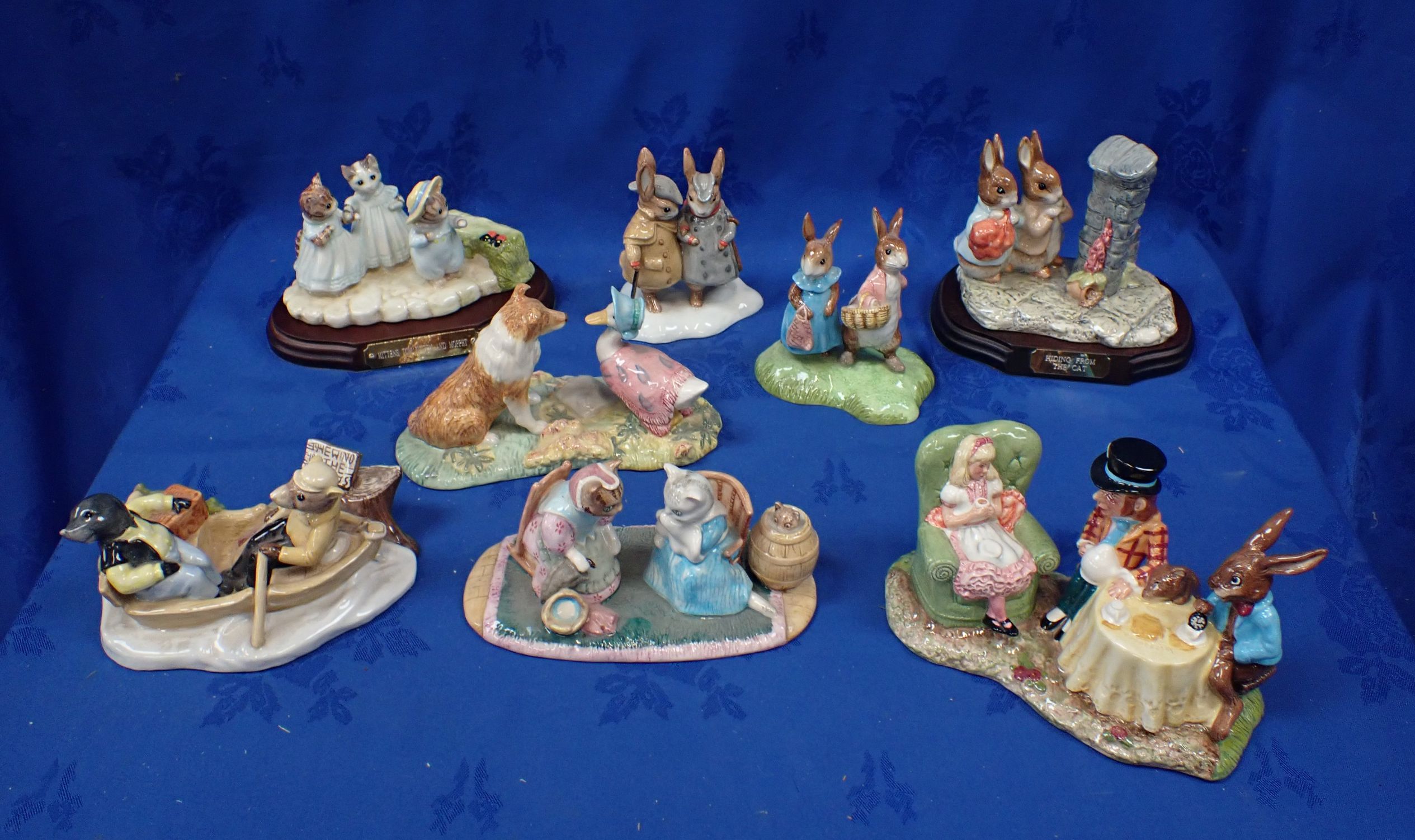 A COLLECTION OF ROYAL DOULTON AND BESWICK BEATRIX POTTER FIGURINES