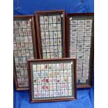 A COLLECTION OF FRAMED CIGARETTE CARDS