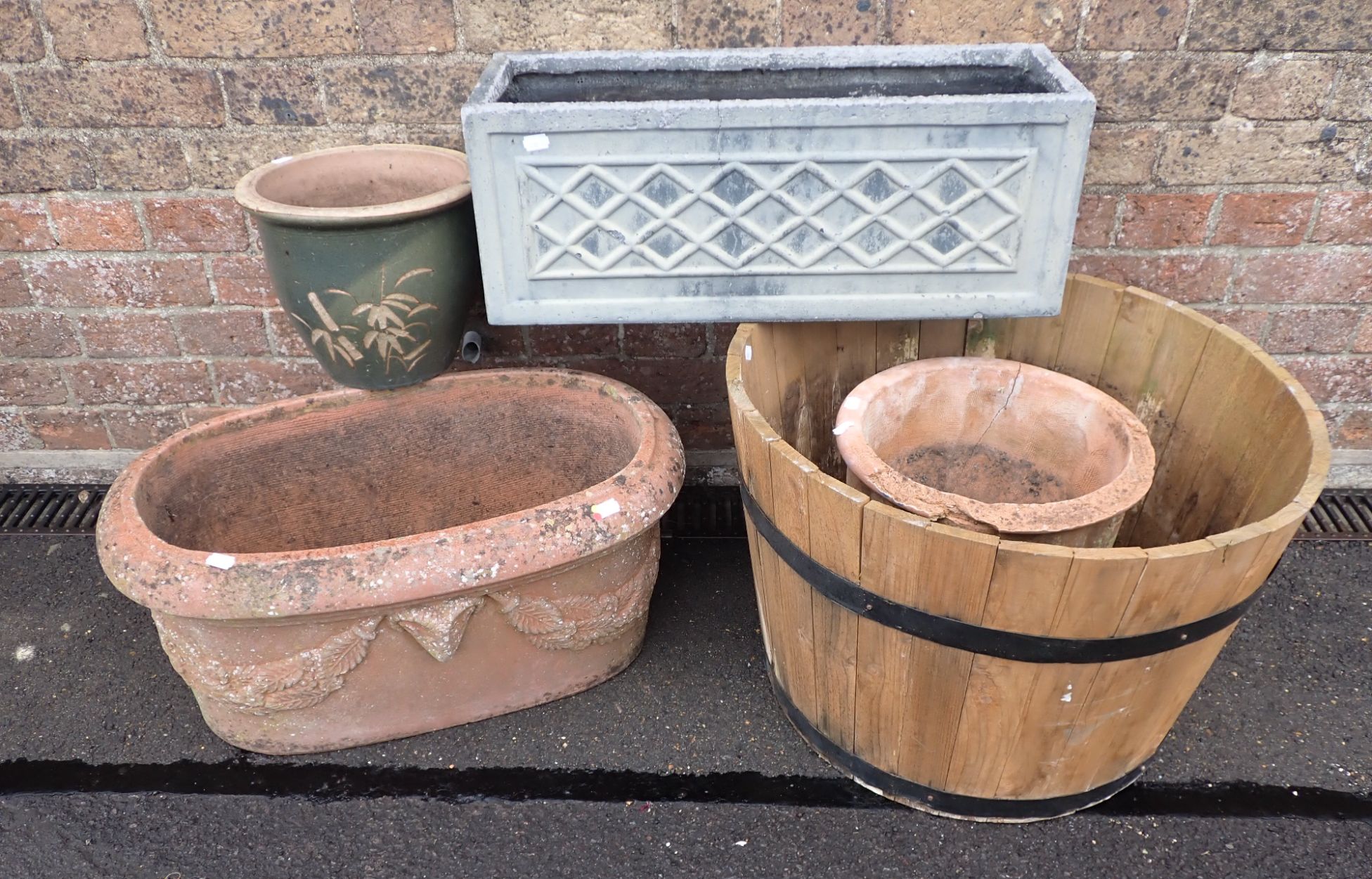 AN OVAL TERRACOTTA PLANTER