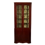 A GEORGE III MAHOGANY CORNER CUPBOARD