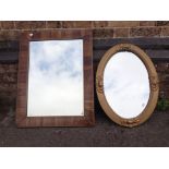 AN EDWARDIAN ROSEWOOD VENEERED SHALLOW CUSHION FRAMED MIRROR