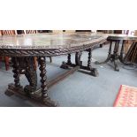 A 19TH CENTURY CARVED OAK DINING TABLE