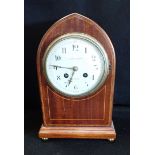 AN EDWARDIAN MAHOGANY CASED MANTEL CLOCK