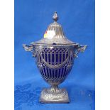 A SILVER PIERCED URN WITH SWAGS AND MOULDED HANDLES