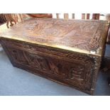 A PROFUSELY CARVED CAMPHORWOOD TRUNK