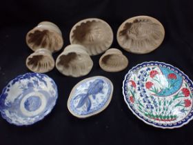A COLLECTION OF STONEWARE JELLY MOULDS
