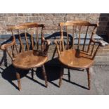 A MATCHED PAIR OF VICTORIAN SPINDLE-BACK KITCHEN ARMCHAIRS