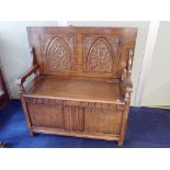 AN OAK MONK'S BENCH, WITH CARVED BACK