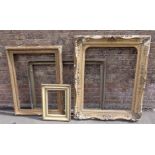 THREE VICTORIAN GILT PICTURE FRAMES, AND ANOTHER LATER