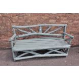 A RUSTIC PAINTED WOOD GARDEN BENCH
