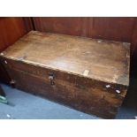A LARGE WOODEN TRAVELLING TRUNK
