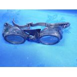 A PAIR OF VINTAGE BLACK METAL GOGGLES