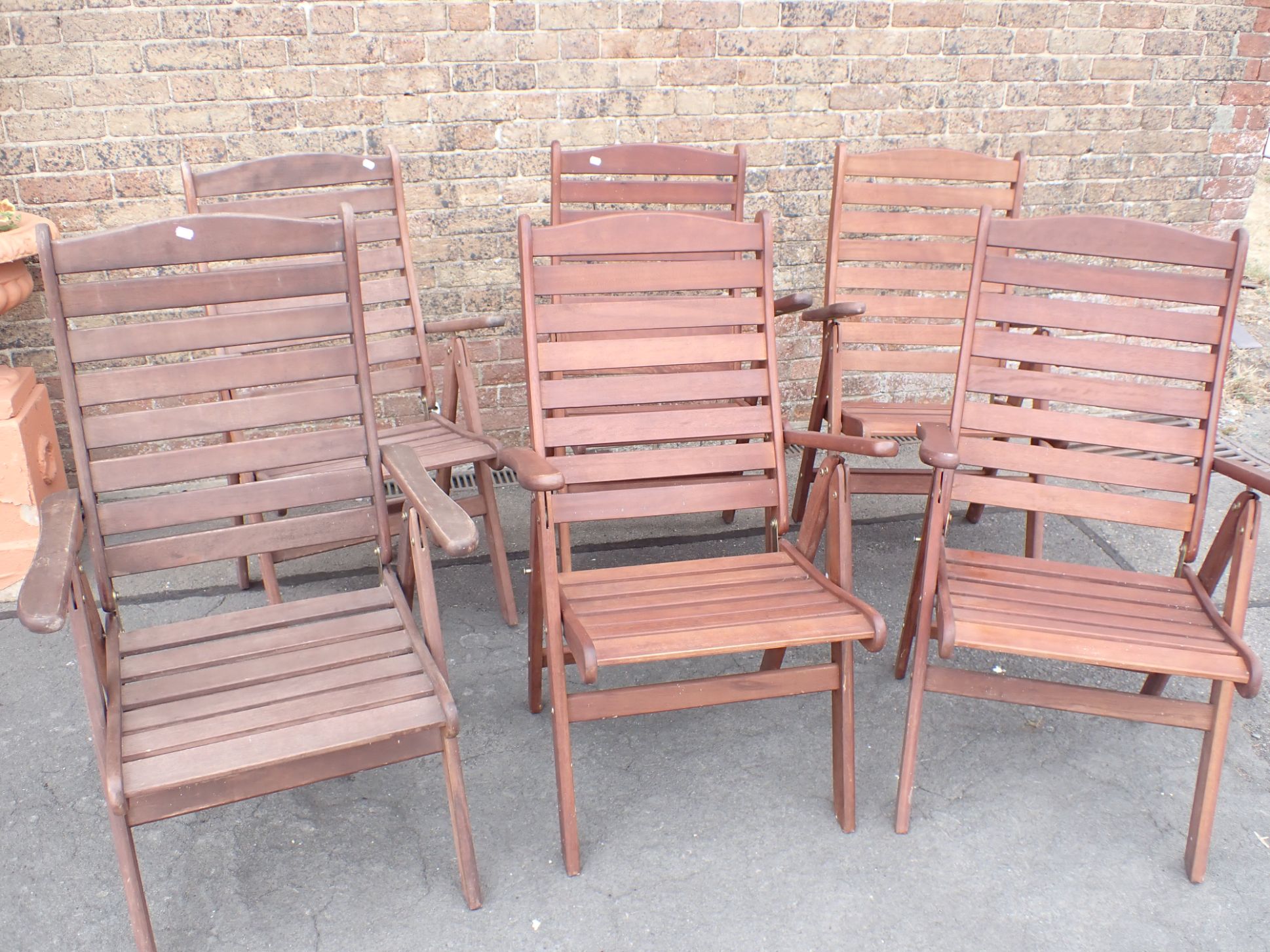 A SET OF SIX TEAK GARDEN ARMCHAIRS