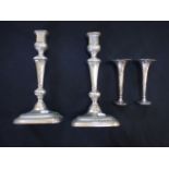 A PAIR OF SILVER PLATED CANDLESTICKS
