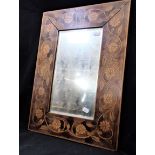 AN EDWARDIAN PENWORK FRAMED MIRROR