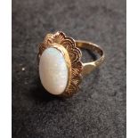 A YELLOW GOLD OPAL COCKTAIL RING