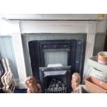 A REGENCY STYLE PAINTED PINE FIRE SURROUND