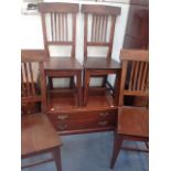 A SET OF FOUR STAINED WOOD DINING CHAIRS
