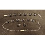 A BLACK STONE AND SILVER NECKLACE/BRACELET AND EARRING SET