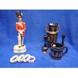 A PORCELAIN FIGURE OF A GRENADIER GUARDS OFFICER