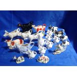 A COLLECTION OF CERAMIC COW CREAMERS