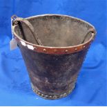 A COPPER MOUNTED LEATHER BUCKET
