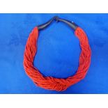 A MULTI-STRAND CORAL BEAD NECKLACE