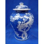 A CHINESE BLUE AND WHITE PRUNUS VASE AND COVER