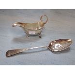 A 20TH CENTURY SILVER SAUCE BOAT AND A GEORGE IV SERVING SPOON