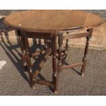 A SMALL OAK GATE-LEG TABLE