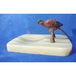 AN ART DECO COLD-PAINTED MACAW PARROT MOUNTED ASHTRAY
