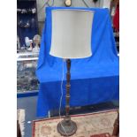 A CAST METAL STANDARD LAMP OF ASIAN DESIGN